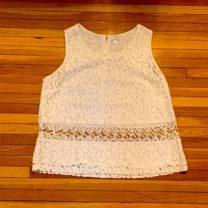 Elegant lace top with cut-outs.